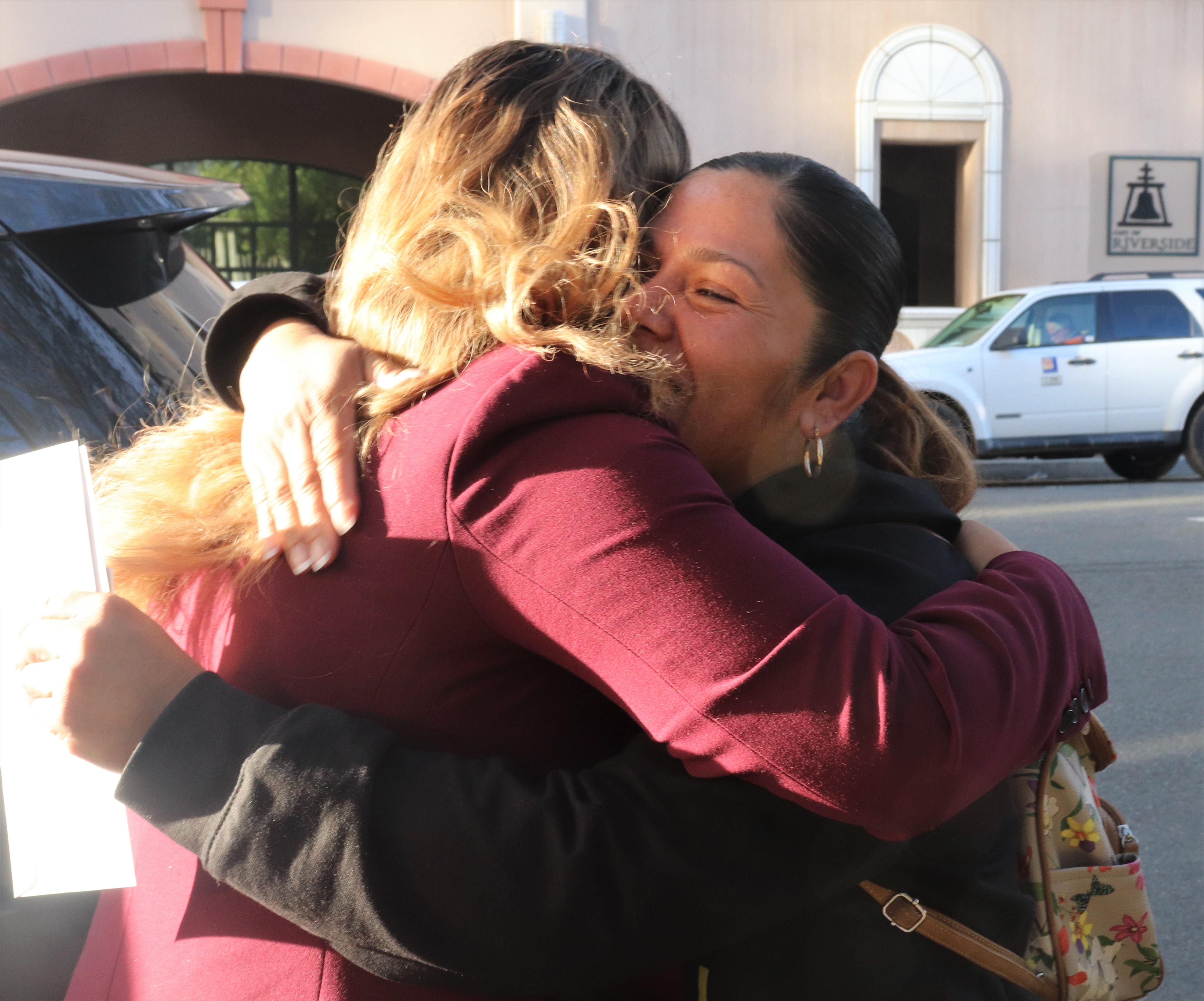 Ernestina hugs Victim Services Specialist Cynthia Martinez